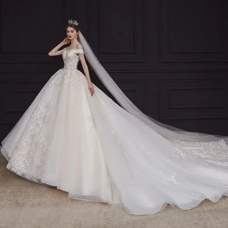 Luxury Off-Shoulder Wedding Dress - Handmade Lace Ball Gown | Femstylo