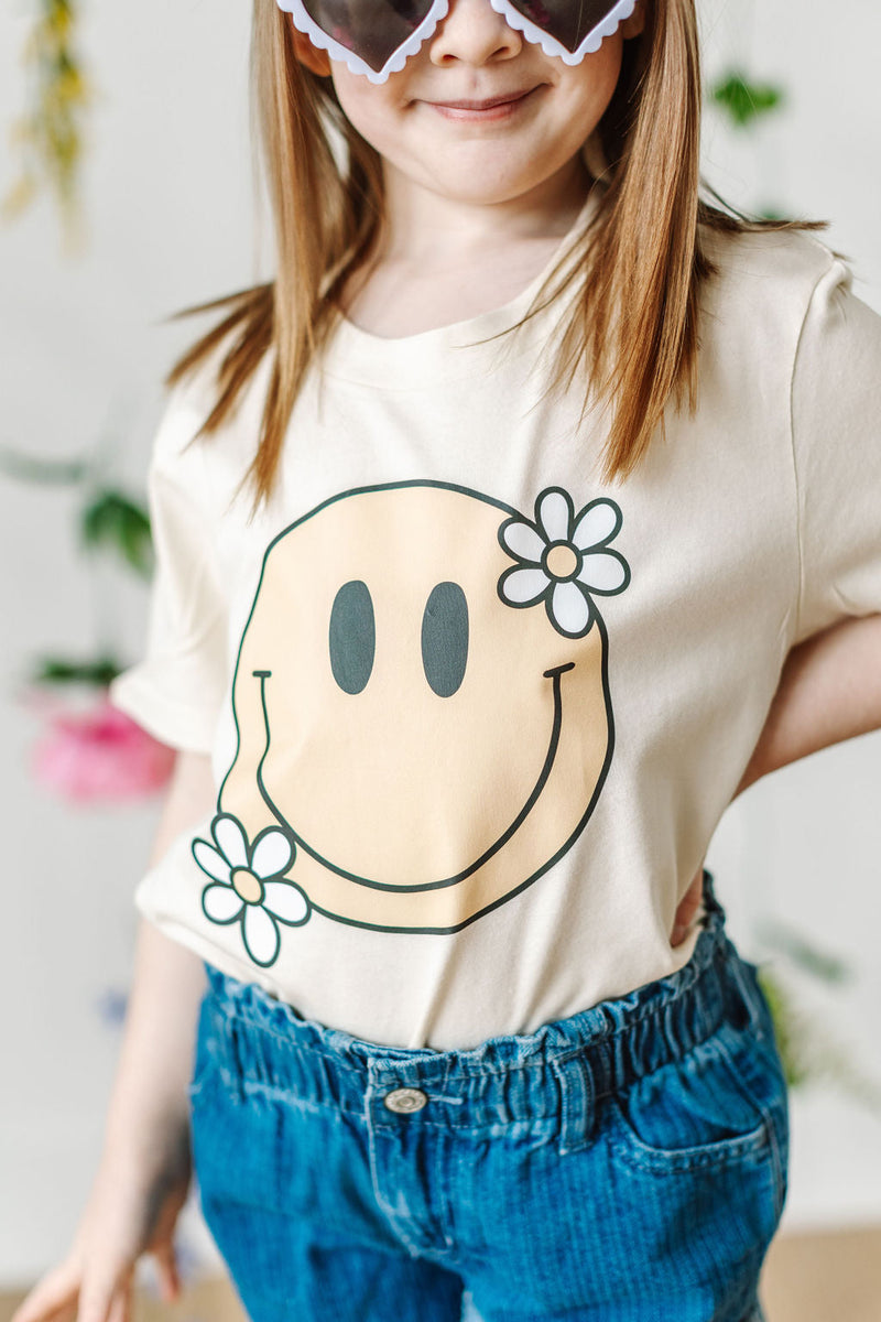 Big Smiley w/ Flowers - Child Tee