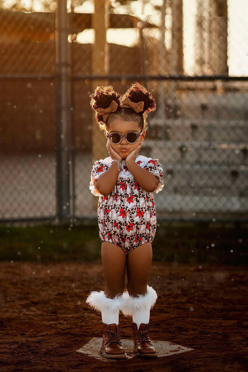 Smocked leopard baseball romper