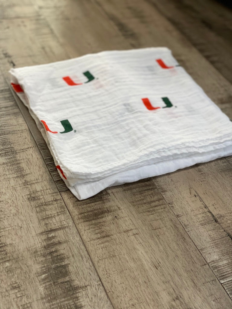 University of Miami Hurricanes Muslin Swaddle Blanket – Soft Breathable 47x47 Baby Blanket – Officially Licensed The U Newborn Gift