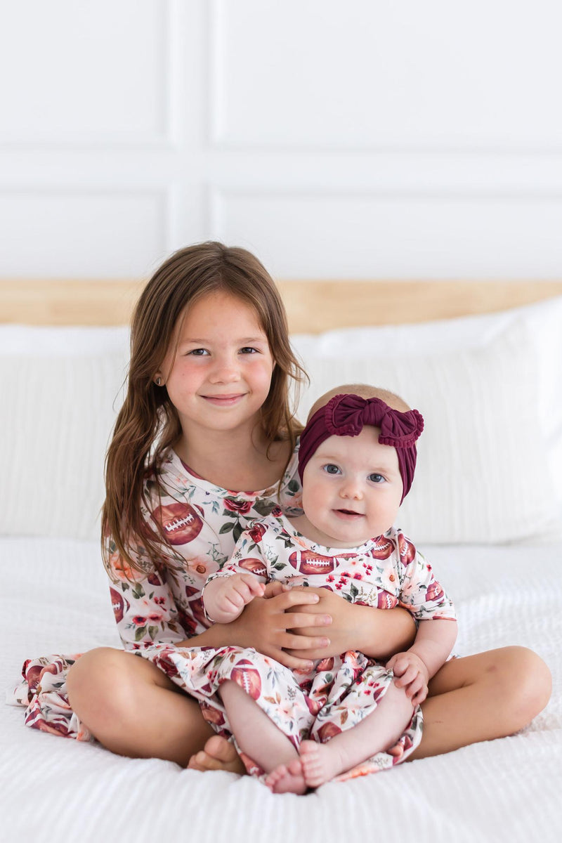 Footballs & Flowers 3/4 Sleeve Twirl Bodysuit