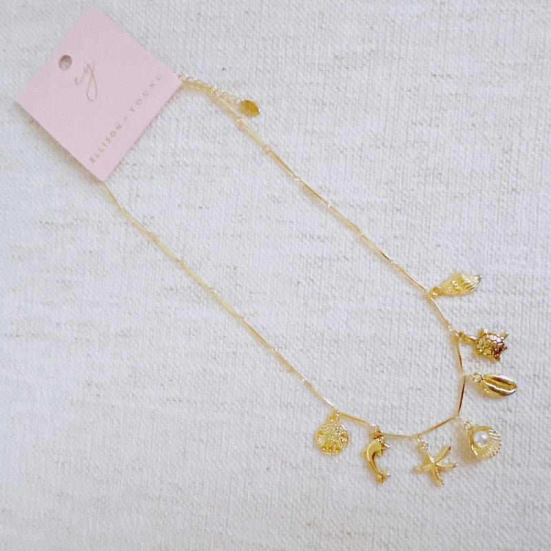 Golden Sea Charm Necklace – Shell, Dolphin & Starfish