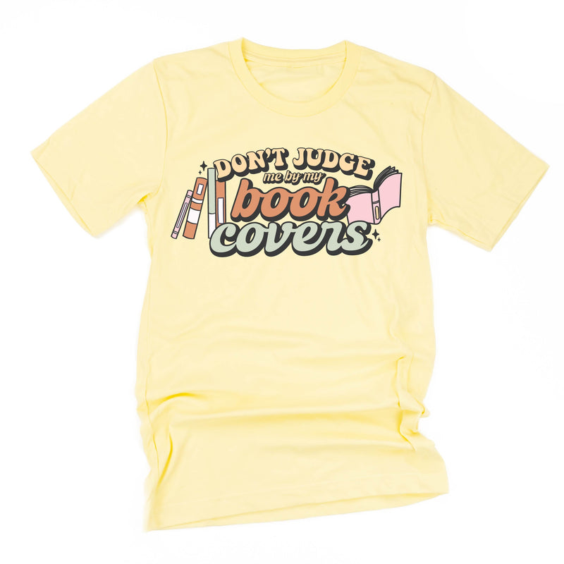 Don't Judge Me By My Book Covers - Unisex Tee