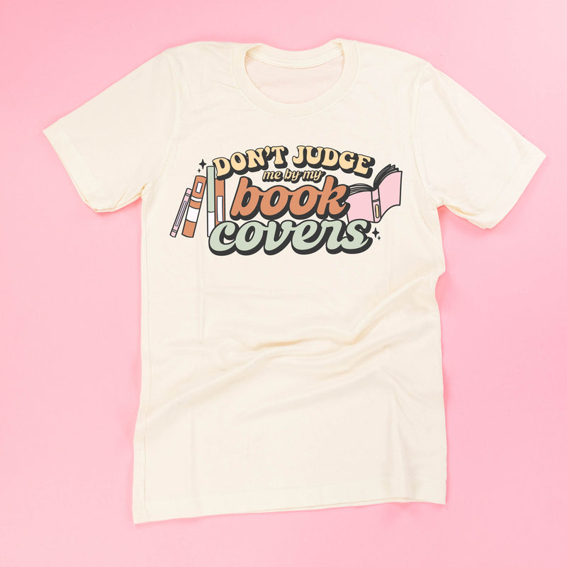 Don't Judge Me By My Book Covers - Unisex Tee