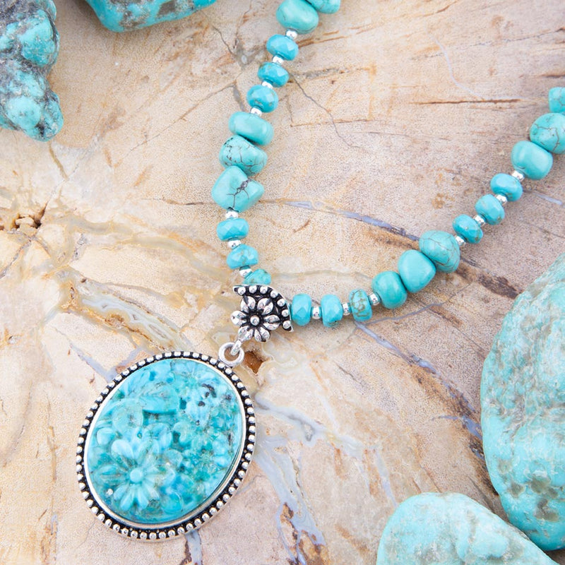 Carved Blue Turquoise and Sterling Silver Pendant