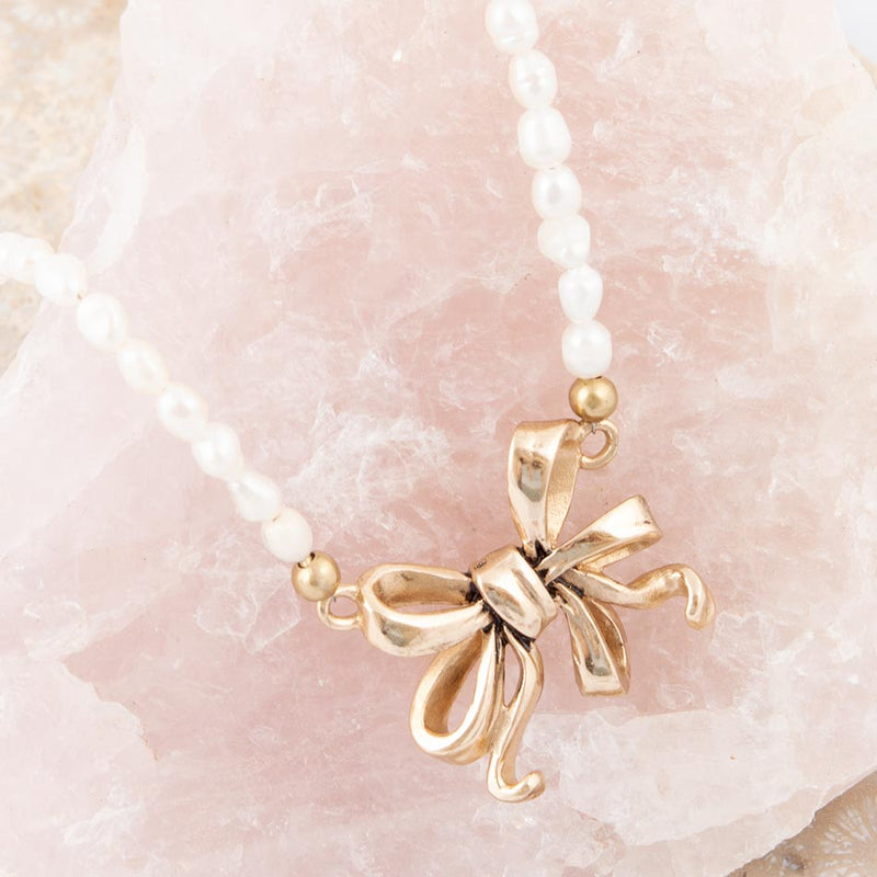 Gifted Freshwater White Pearl Golden Bow Pendant Necklace
